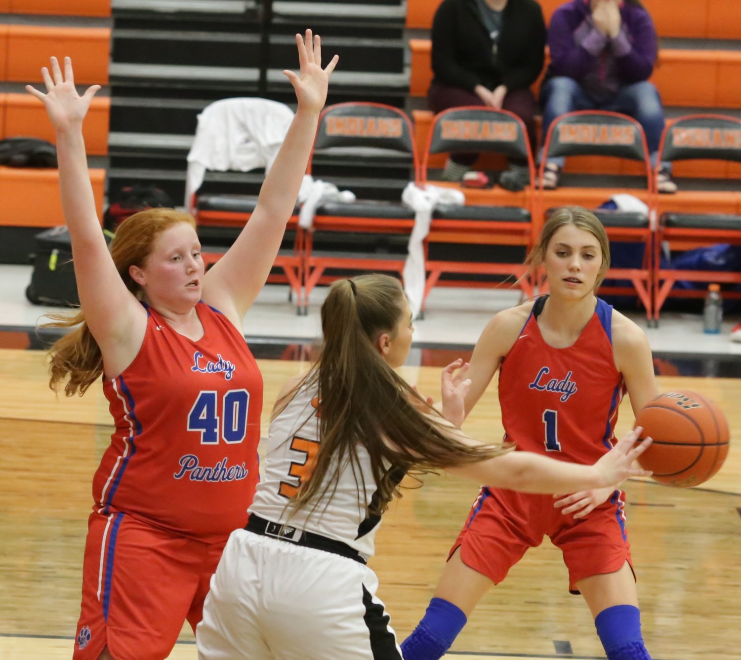 Kylie Kennedy (40) and Crimson Bryant (1) defend in the season-ending contest against Grand Saline.